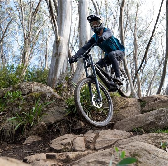 Mountain biker riding a steep section of Thredbo's iconic downhill trail
